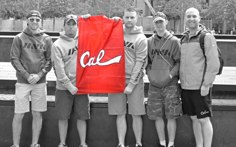 Veterans hold a PennWest California flag